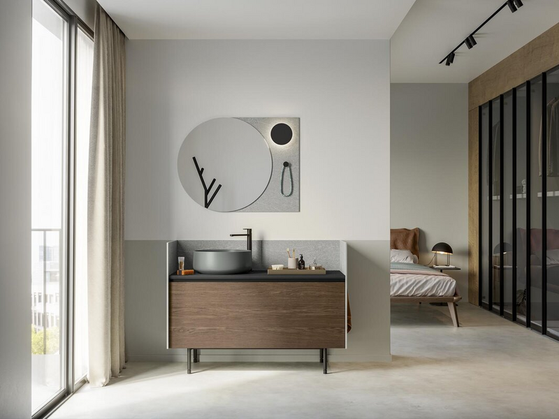 Bagno in essenza rovere castoro, top in ecomalta grafite, lavabo in ceramica grigio oliva opaco, fianchi e schiena in HPL Pietra Piasentina, piedini e maniglia in metallo nero