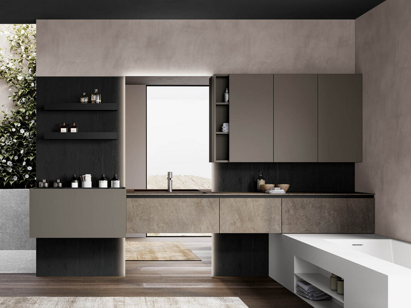 Bagno in laccato opaco grigio aston, schiene attrezzate in essenza rovere carbone, top e frontali in gres Jasper moka, accessori metallici in metallo nero