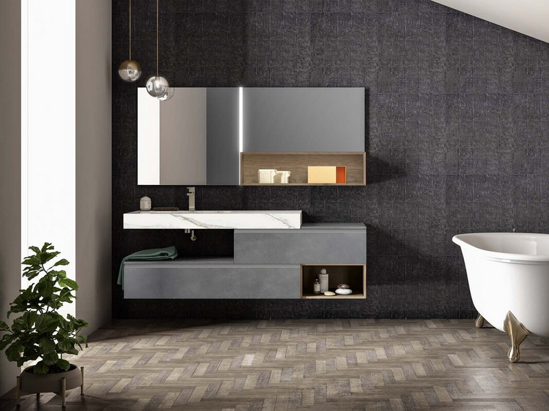 Bagno in laccato metallico piombo, vani a giorno in essenza rovere visone, top in gres Larsen bianco